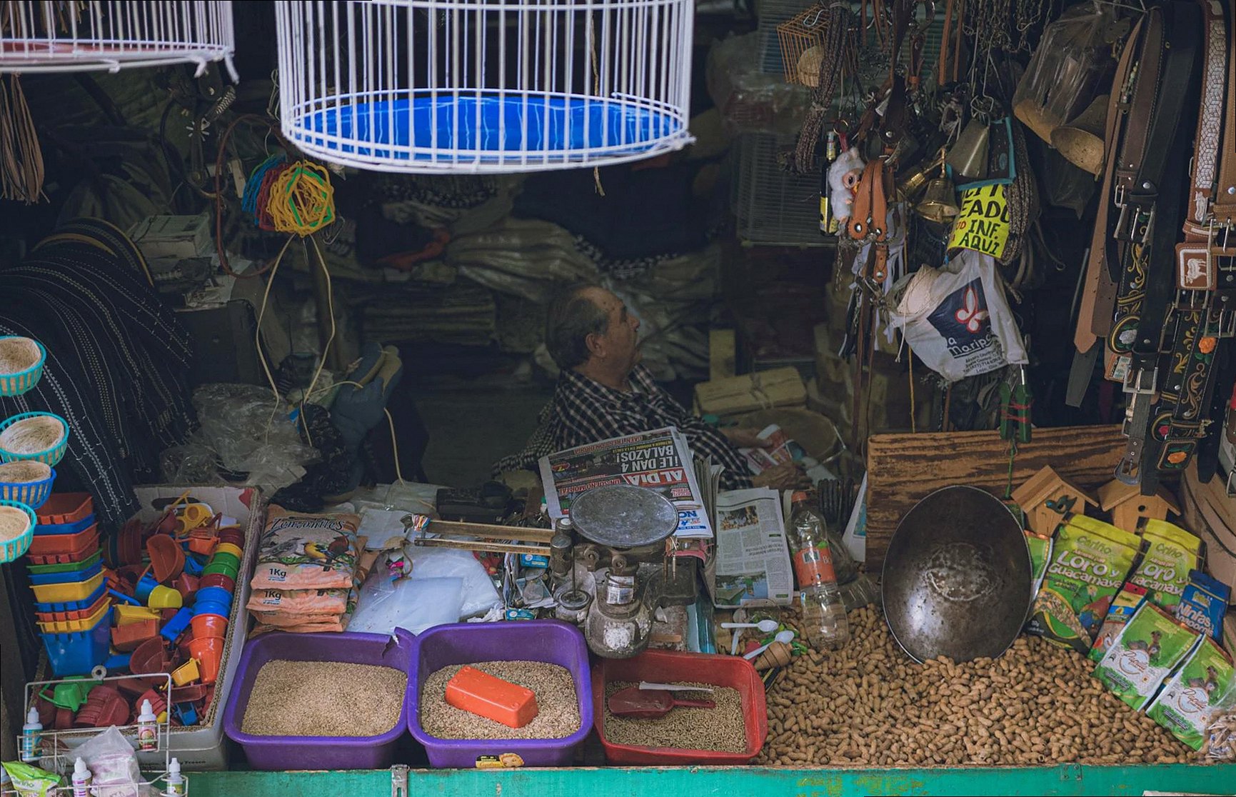 A vibrant market stall in Guanajuato, showing an array of goods and a vendor inside.